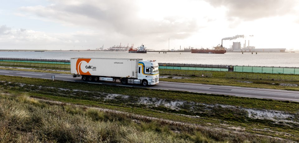 A van der Stek truck driving with a ColliCare container at the Maasvlakte, Rotterdam, Netherlands.