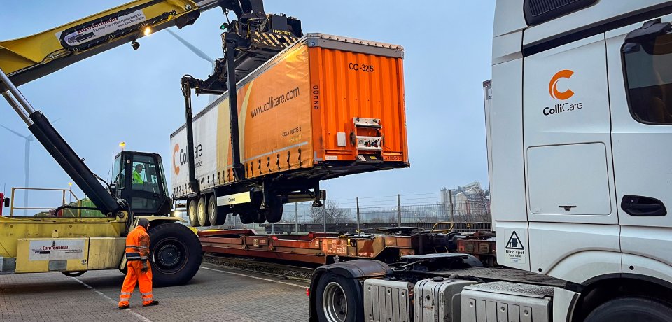ColliCare trailer is loaded upon a flatcar (TOFC)