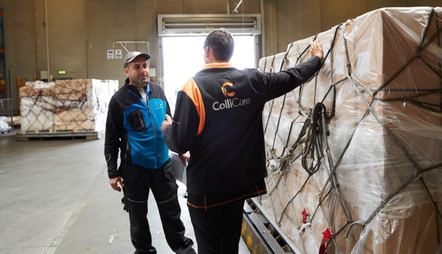 ColliCare-employee discusses logistics concerning goods and cargo.