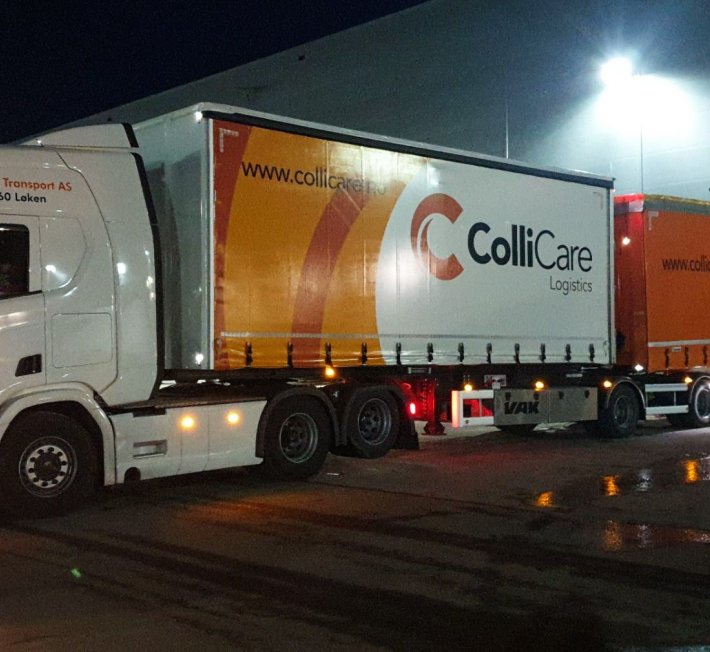Road train loading by night